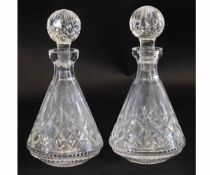 Pair of lead crystal ship style decanters with engraved decoration, 27cms high