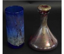 Two pieces of Isle of Wight glass, one a cylindrical vase with a blue white streak design, the other