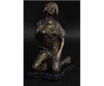 Modern cold painted bronze of a young girl kneeling on black shaped slate base, 30cms tall