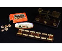 Inlaid bone cribbage board, a further Torquay ware small pin dish, a set of postal scales and a