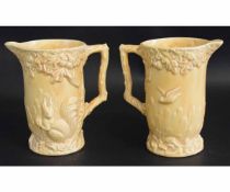 Pair of Wade yellow ground jugs with raised detail of a squirrel among an oak tree, with a printed