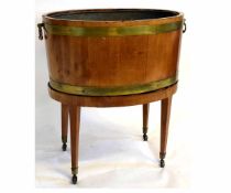 Georgian mahogany and brass banded oval wine cooler and stand, with tapering square legs, raised
