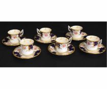 Group of Coalport coffee cups with gilt and blue decoration with floral sprays, late 19th/early 20th