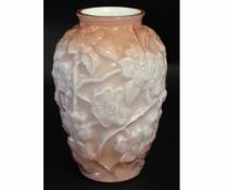 Cranberry pink style glass by Fenton USA, the pink body with moulded floral designs, 30cms high