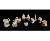 Collection of Goss and other factories heraldic wares of various shapes and sizes, largest jug