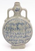 Chinese studio porcelain moon flask with loop handles, covered in a thick pale celadon glaze with