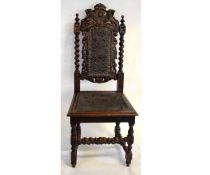 Pair of Victorian Gothic heavily carved hall chairs with pressed leather detail to seat and back