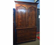 19th century mahogany linen press with two arched panelled cupboard doors over two over two full