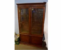 19th century mahogany floor standing bookcase with two glazed doors over two panelled cupboard