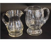 Two glass engraved jugs, one of waisted form with loop handles, largest 18cms