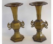 Pair of Chinese vases probably bronzed, with scroll handles and flared necks on faceted bases, 29cms