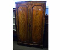 Victorian mahogany two panelled door wardrobe with turned knob handles, raised on bracket feet,