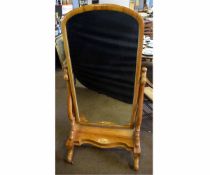 Victorian mahogany framed cheval mirror with scrolling supports and a shaped stretcher raised on