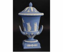 Good quality blue basalt two-handled urn formed vase with lid, with raised classical figures,