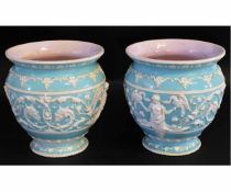 Pair of 19th century jardinieres decorated with a turquoise ground with a white raised detail of