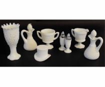 Collection of milk glass wares with a hobnail design including a cruet, two vinegar bottles, a top