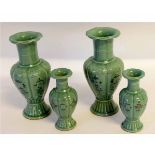 Set of four vases, two of baluster shape and two smaller vases with floral decoration on a celadon
