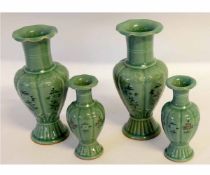 Set of four vases, two of baluster shape and two smaller vases with floral decoration on a celadon