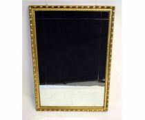 Late 20th century rectangular wall mirror with gilt frame with repeating design and bevelled