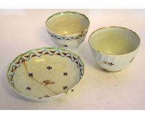 Lowestoft late 18th century tea bowl and saucer, with Derby style sprigs of flowers within a feather