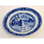 19th century blue and white printed plate decorated with an Oriental village scene, 22cms diam