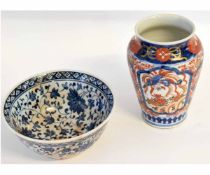 Japanese Imari vase of baluster shape, together with a blue and white bowl, the vase 15cms high