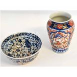 Japanese Imari vase of baluster shape, together with a blue and white bowl, the vase 15cms high