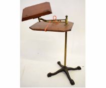 Early 20th century adjustable brass and mahogany reading stand with swing arm on a decorative cast