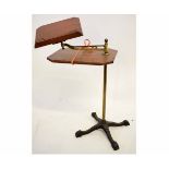 Early 20th century adjustable brass and mahogany reading stand with swing arm on a decorative cast