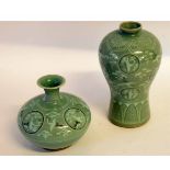 Two vases, one squat vase, and one of baluster shape, decorated with birds on a celadon ground,