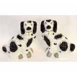 Pair of good quality Staffordshire dogs decorated in black and white with a gold chain, each 30cms