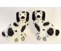 Pair of good quality Staffordshire dogs decorated in black and white with a gold chain, each 30cms