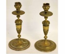 Pair of good quality cast brass candlesticks on circular bases with cast and knopped column, with