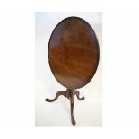 Early 19th century mahogany circular tilt top pedestal table with tripod base, 83cms diam