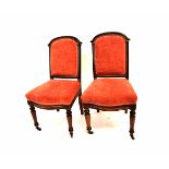 Set of six parcel ebonised dining chairs, hoop backs, upholstered in pink