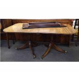 19th century mahogany twin pedestal dining table together with an extra leaf, measuring extended