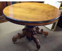 Parcel ebonised mahogany oval dining table on quadruped base, 110cms wide
