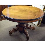 Parcel ebonised mahogany oval dining table on quadruped base, 110cms wide