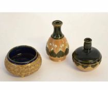 Two Royal Doulton stoneware miniature bottles, both with green glaze neck with floral design to