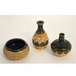 Two Royal Doulton stoneware miniature bottles, both with green glaze neck with floral design to