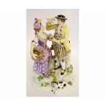 19th century Meissen group, a gallant and lady, with a basket of flowers in her hand and the