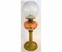 Victorian oil lamp with brass circular reeded column on a circular pressed brass base with a puce