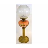 Victorian oil lamp with brass circular reeded column on a circular pressed brass base with a puce