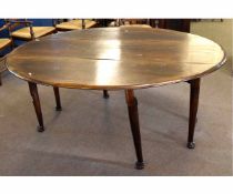 Late 20th century oak oval formed drop leaf gate leg table, supported on four pad and ball feet,