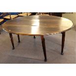 Late 20th century oak oval formed drop leaf gate leg table, supported on four pad and ball feet,