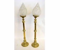 Pair of Victorian brass lamps with knopped columns on circular bases with shaped conical shades,
