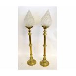 Pair of Victorian brass lamps with knopped columns on circular bases with shaped conical shades,