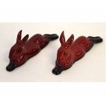 Two Royal Doulton flambe models of reclining rabbits, each 10cms long