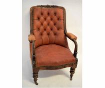 19th century mahogany armchair with red leather upholstered and buttoned back on turned and carved