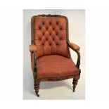 19th century mahogany armchair with red leather upholstered and buttoned back on turned and carved